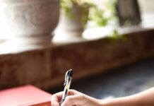 생활 속 스트레스 해소를 위한 간단한 루틴 a person writing on a piece of paper with a pen