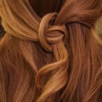 “건강한 모발 관리, 일상 속 작은 변화에서 시작하세요” brown hair on white textile